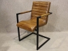 tan leather armchair with steel frame