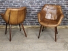 armchairs in tan leather