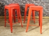 funky red stacking tolix style stool